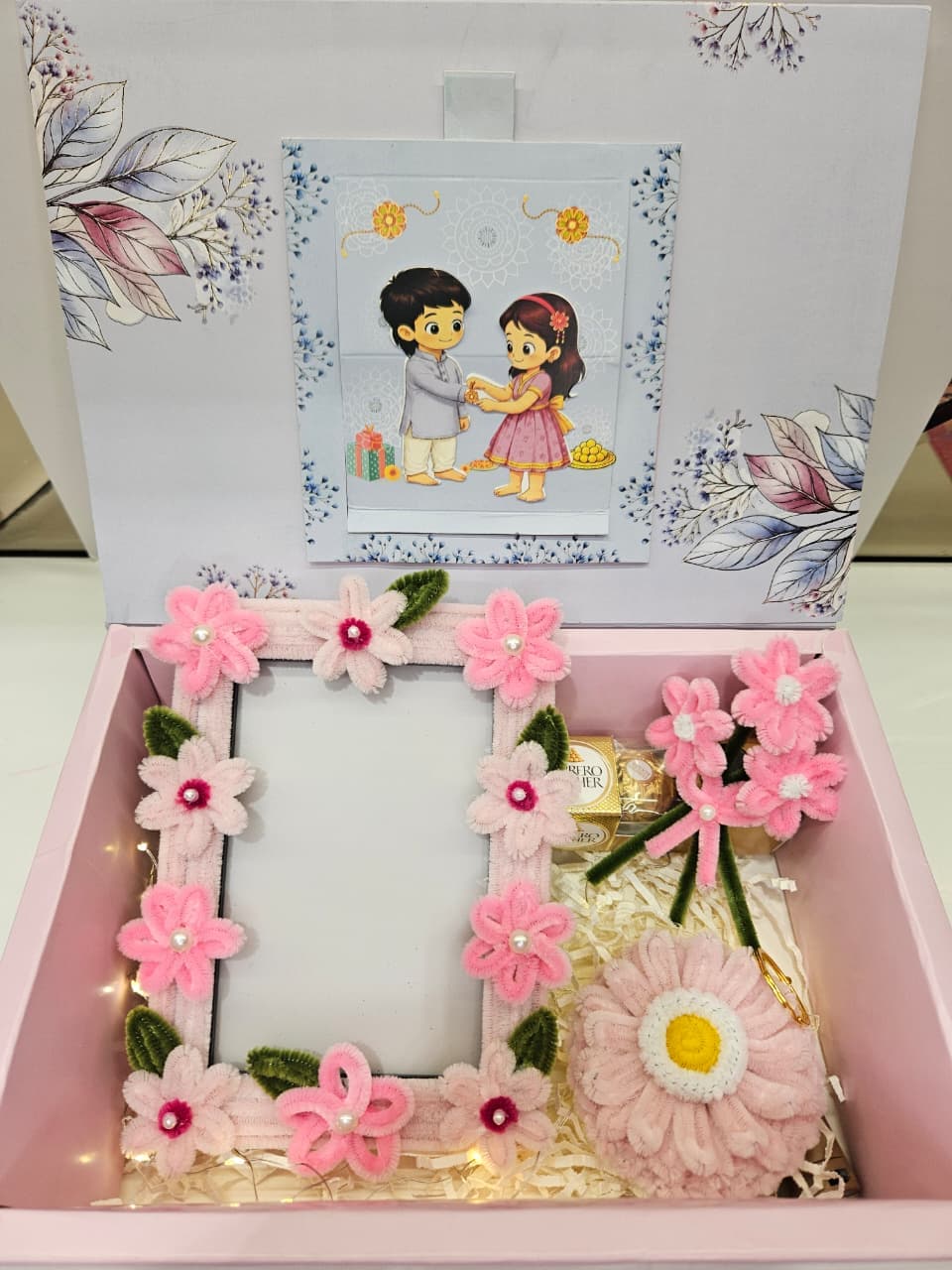Blush Blooms Rakhi Hamper — handcrafted photo frame, blooms and chocolates in a keepsake box